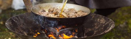 Comment réussir sa cuisine au feu de camp ? astuces et préparations essentielles